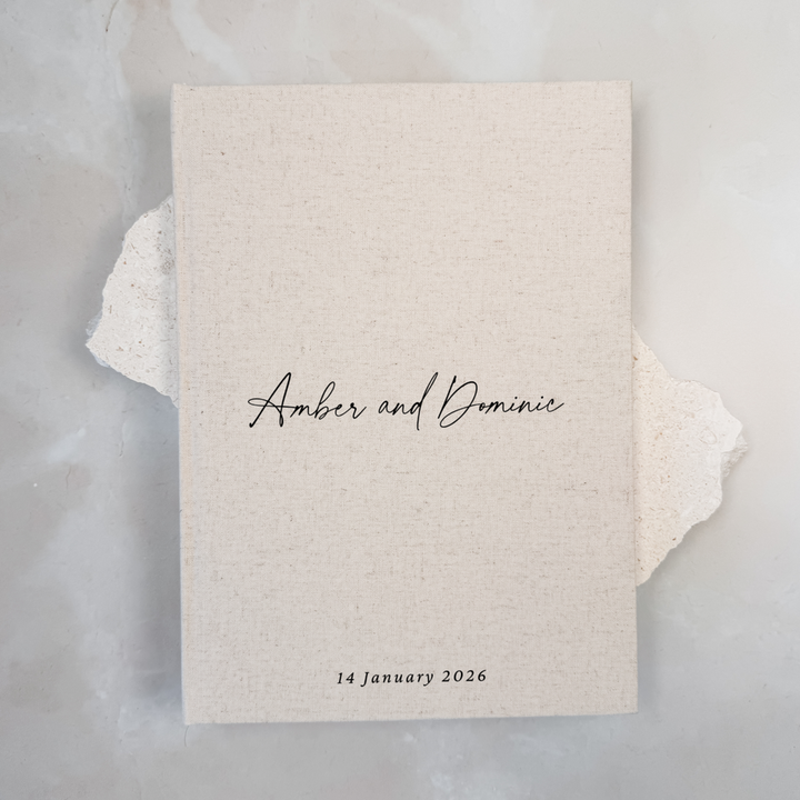 Natural linen personalised wedding guest book with script lettering, portrait format