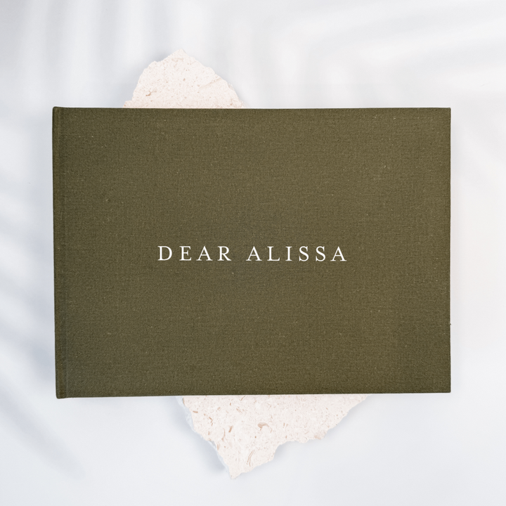 Olive green linen personalised wedding memory book, front cover close-up