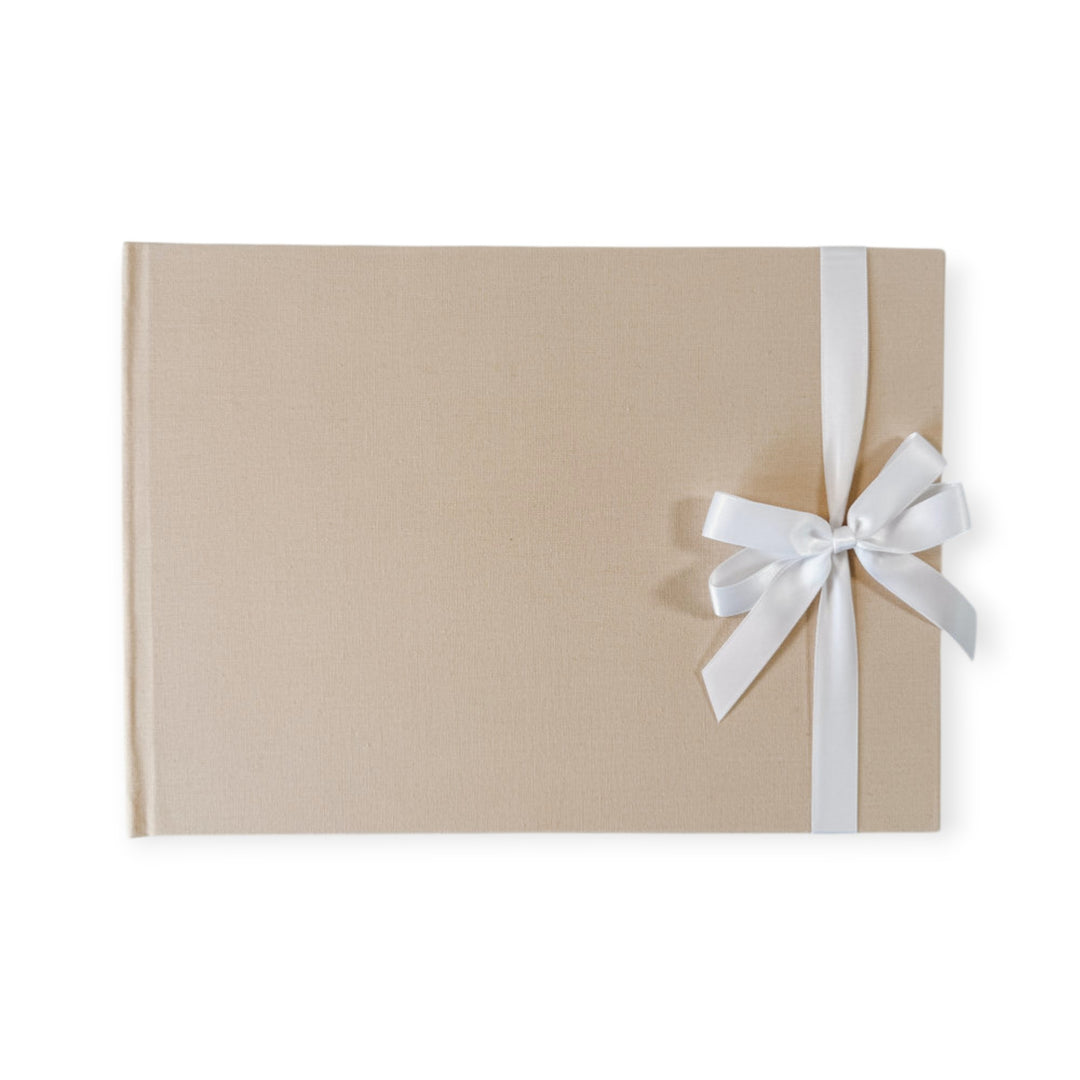 White satin ribbon bow on guest book