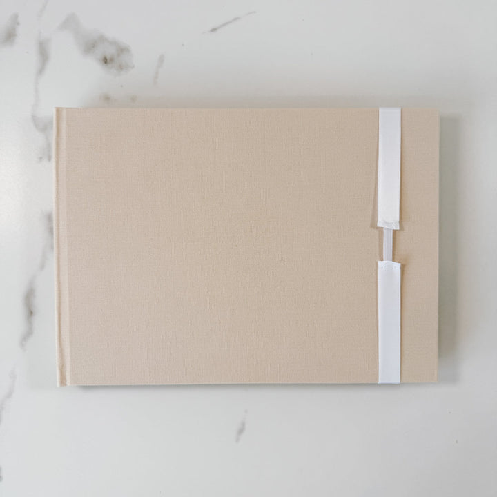 White satin ribbon bow on guest book