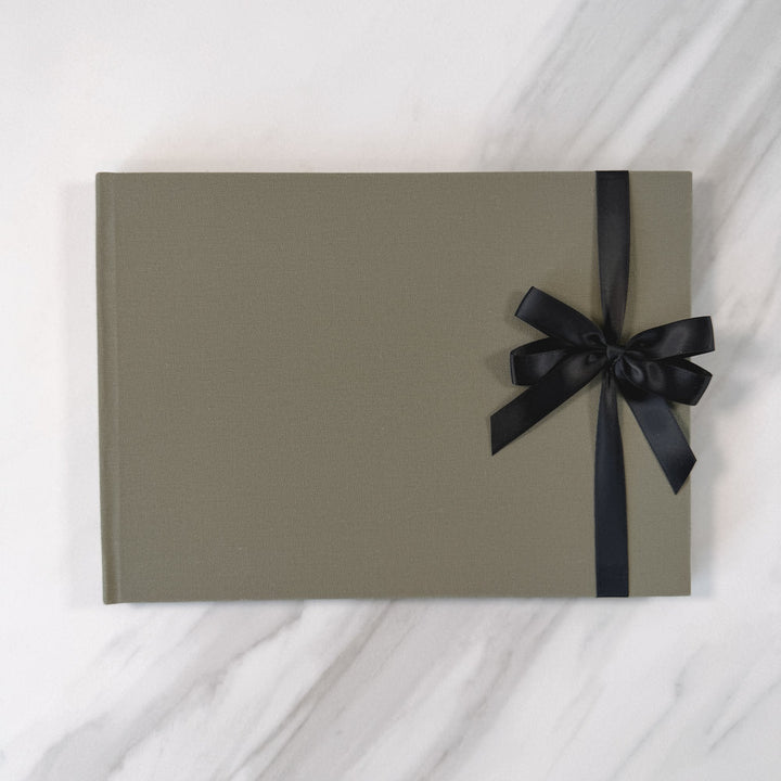 Black satin ribbon bow on guest book