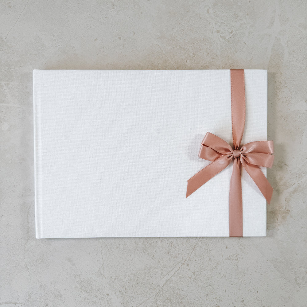 Rose satin ribbon bow on guest book