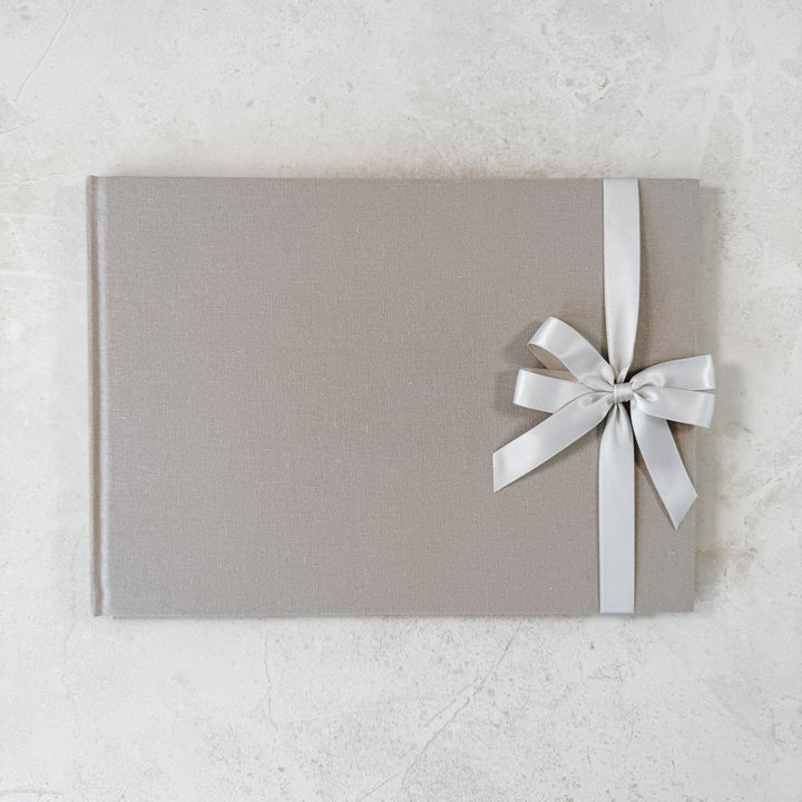 White satin ribbon bow on guest book