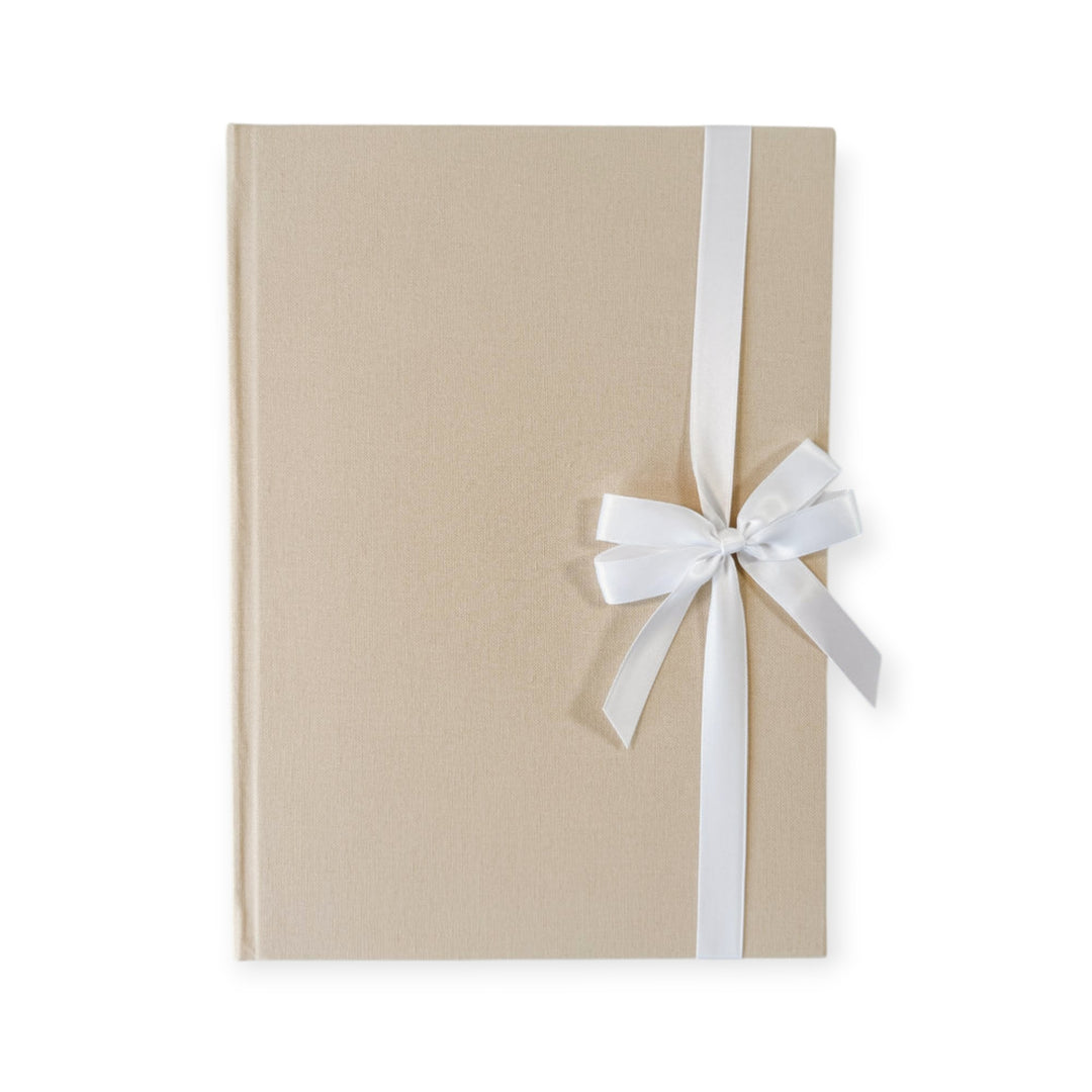 White satin ribbon bow on guest book