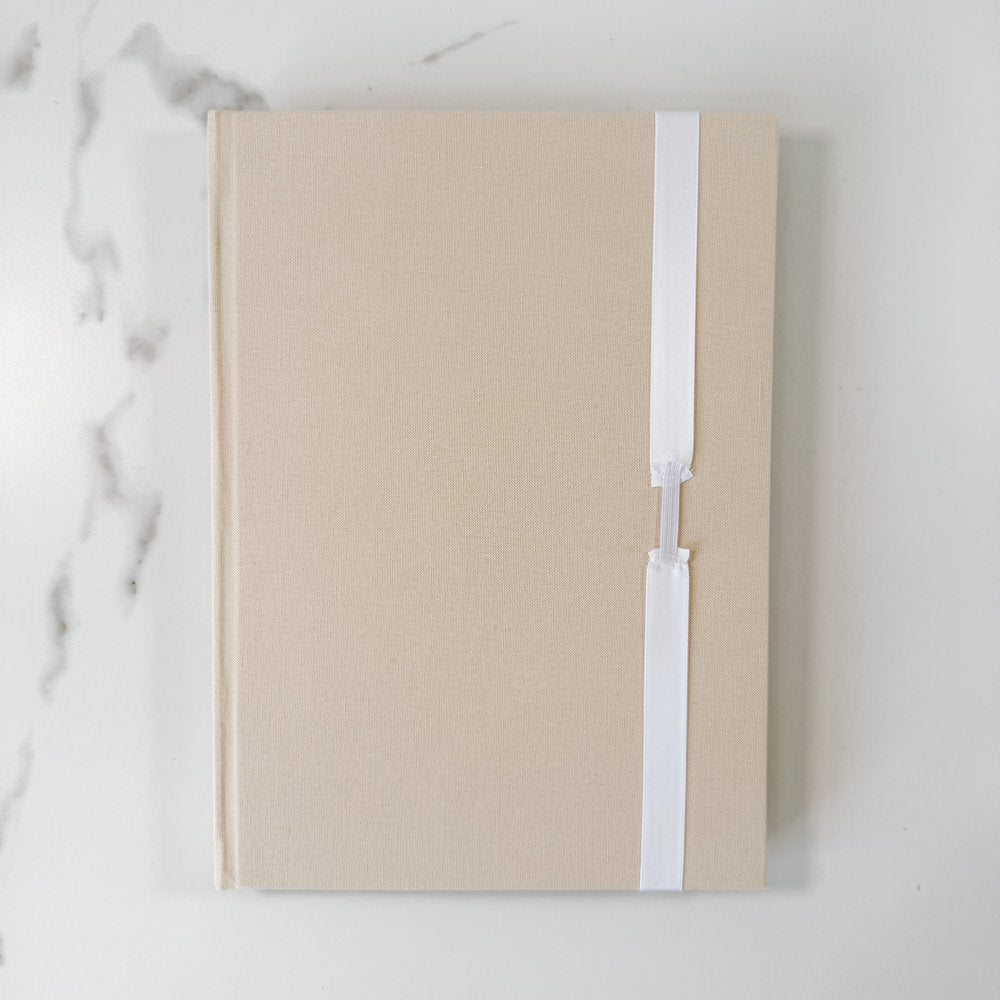 White satin ribbon bow on guest book