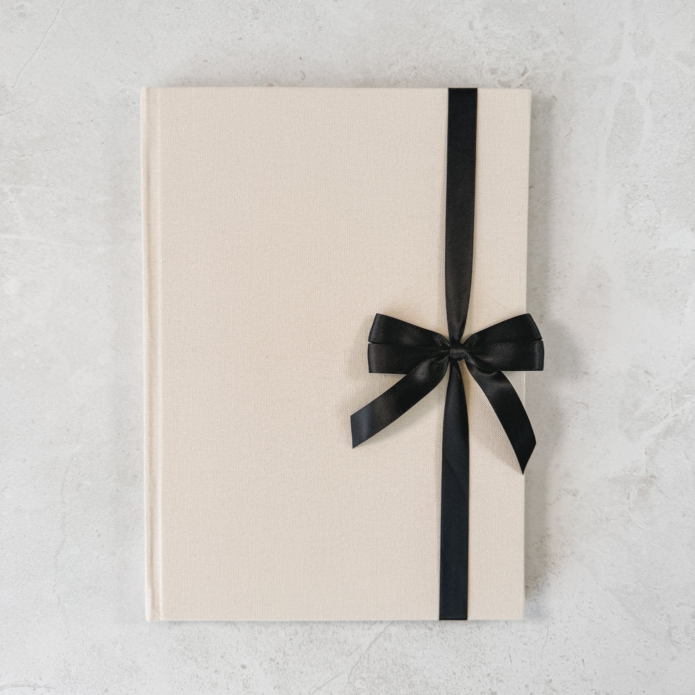 Black satin ribbon bow on guest book