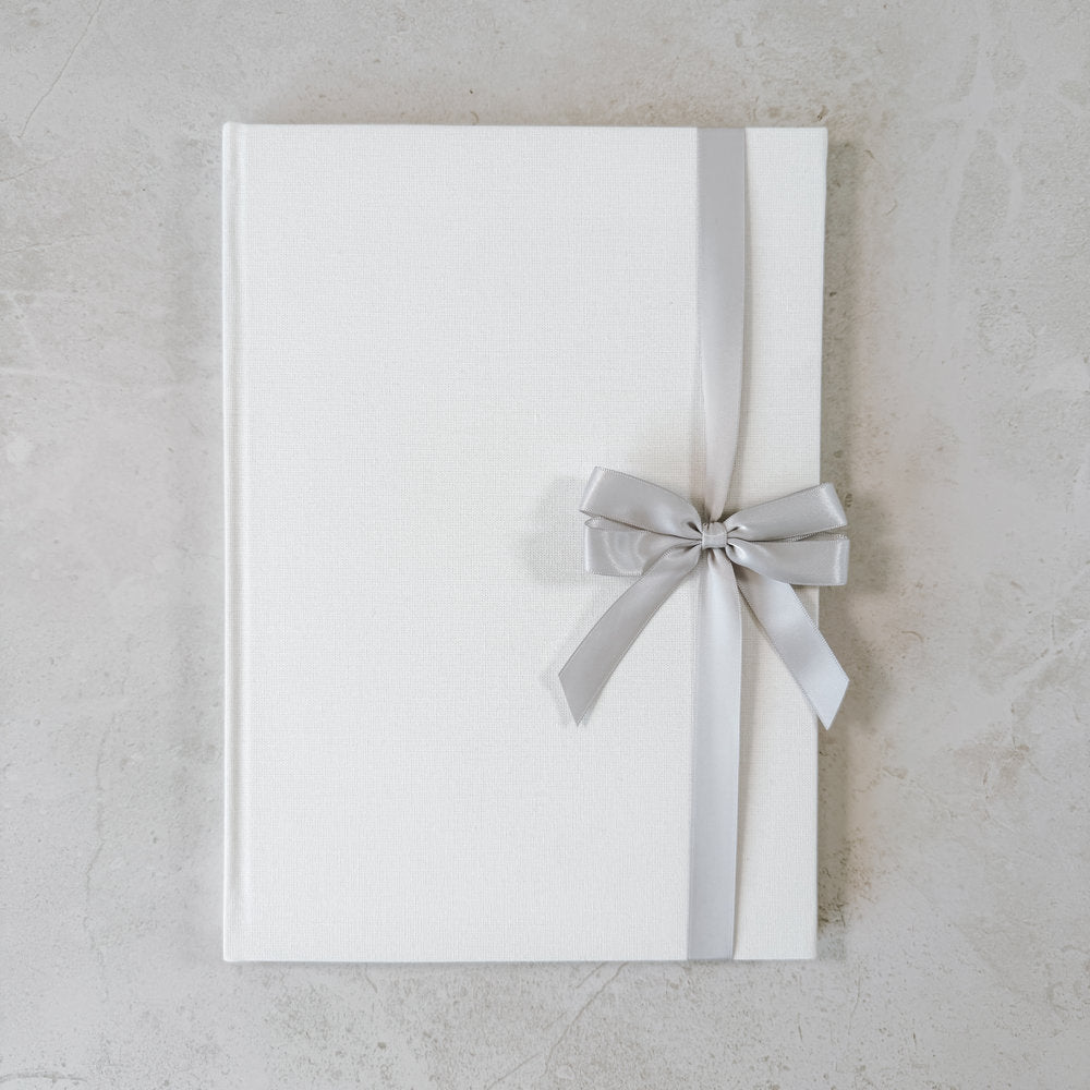 Grey satin ribbon bow on guest book